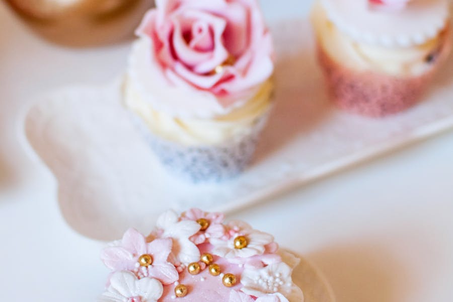 House party dessert table set with assorted cupcakes