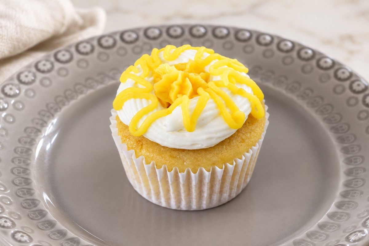 Lemon Poppy Seed cupcake — Nutty Poppyseed Base topped with Tangy and refreshing Lemon curd icing